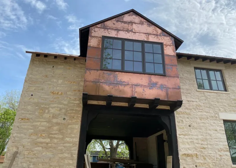 Copper metal panel facade on a stone building for Skylight Installation in Sunland Park